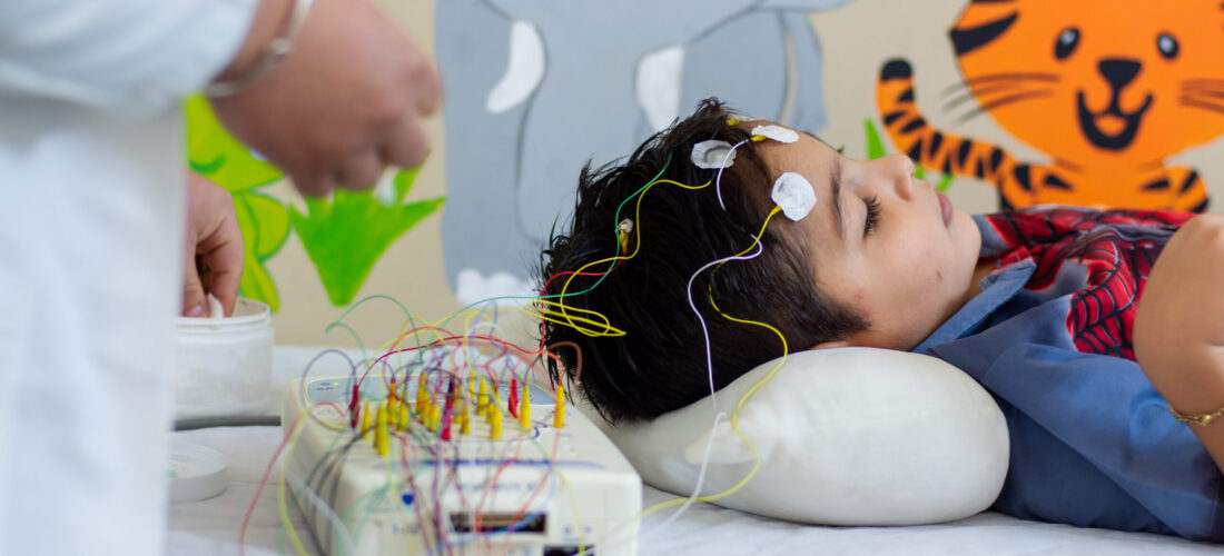 black-haired-child-pediatrician-with-wires-his-head