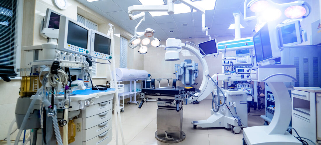 Clinic interior with operating surgery table, lamps and ultra modern devices, technology, hi-tech interior, medicine concept