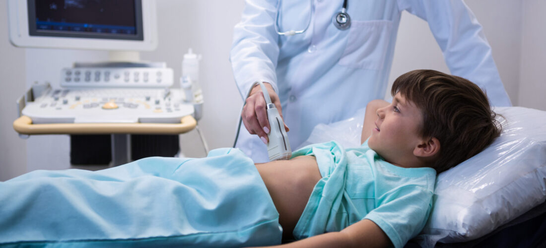 Female doctor doing ultrasound for patient at hospital